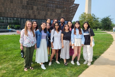Steinhardt students in front of a museum in Washington DC on a sunn day