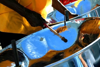 Colorful painting of steel drums being played