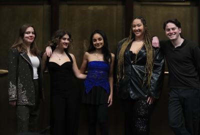 Five members from contemporary vocal ensemble posing together