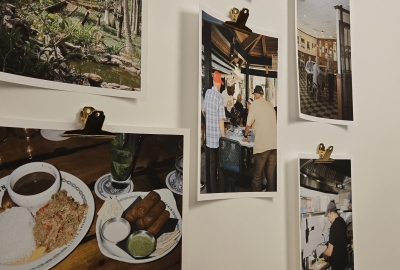 Food-related photography pinned to a wall.