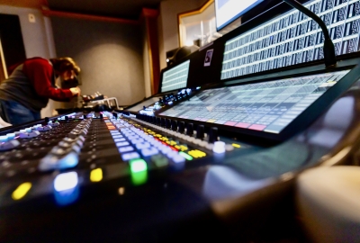 Student at the far end of Music Technology sound board
