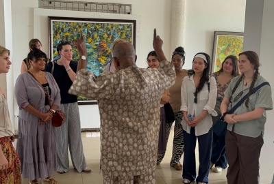 man talking to a group of students