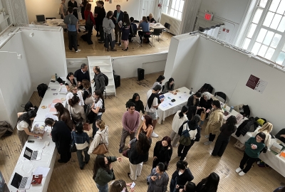 A group of VAA students gather in the Department's Commons exhibition space.