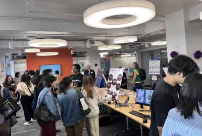 Students explore different presentations at an expo. 