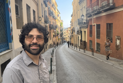 Photo of Andrés with a city street in Madrid in the background