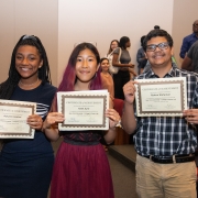 Image of Kate Sum, rising 9th grader with cohort members Autumn Hadnot and Rahzal Rahaman holding certificates of completion