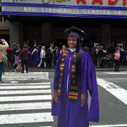 Portrait of Brianna Grant on graduation standing outside Radio City Music Hall