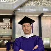 Portrait of Hargreaves Wang in gap and gown.