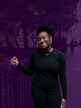 A photo of Jeanine Toussaint, a smiling Black woman, against a purple background.