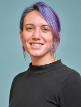 Melody Feo Sverko, a woman with purple hair in a black shirt.