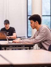 student studying at bobst library