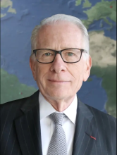 A professional headshot of Allan Goodman 