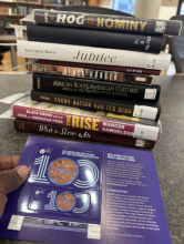 A stack of books for Kasey's capstone, Culinary Acts of Resistance: African Foodways and Their Influence on American Culture.