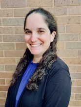 PAA alum Samantha Geffen headshot in front of light brick wall