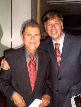 Stanley Drucker and Jerry Bunke wearing suits, smiling for the photo