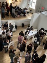 A group of VAA students gather in the Department's Commons exhibition space.