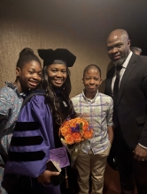 Dora Onwumere at her graduation with her husband and two children