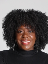 Dr. Chantal Hailey Headshot on grey backgorund. 