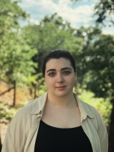 Evelyn Dimov stands for a picture with Riverside Park behind her.