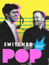 Bright yellow and pink graphic with photo of podcast Switched on Pop creators in black and white