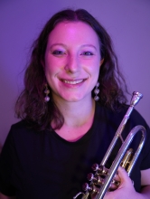 Kate holding a trumpet