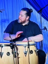 Ian McLeod playing congas