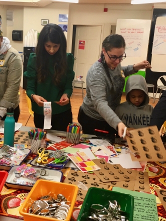 Student working on project with kids