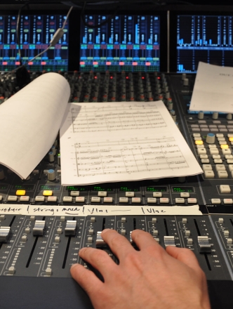 sound mixing board with sheet music
