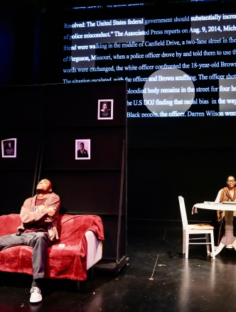 one student sitting on sofa while the other is at the table