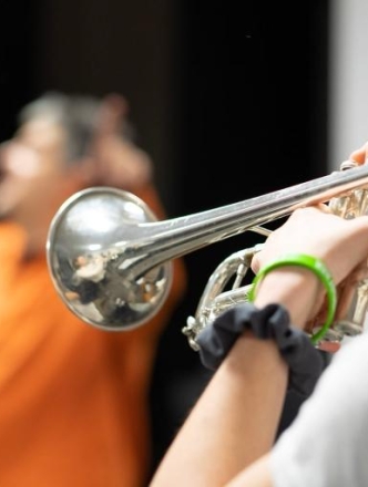 NYU student playing trumpet