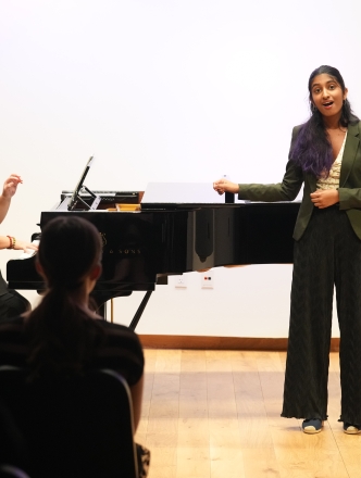 NYU pedagogy student singing classical music with pianist