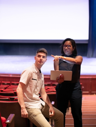 Two students working together in the theatre