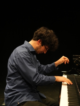 Student at the piano performing