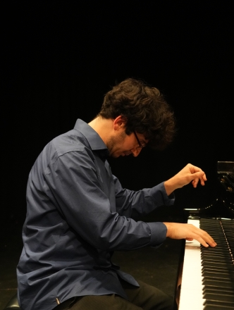 Student at the piano performing