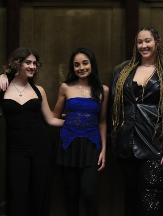 Five members from contemporary vocal ensemble posing together