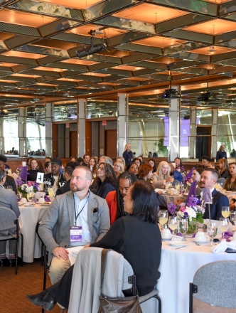The attendees of the 2024 Spirit of Steinhardt Awards Ceremony, seated at tables in a large conference space