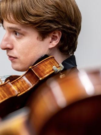 Up close shot of violinist practicing
