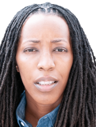 Image captures a headshot of Dr. Bettina L. Love. The phoot captures the NYU Metro Center 2026 Keyunote Speakers against a white backgroun with shoulder length locks. Dr. Love whears a blue collareded denim shirt with a red sportcoat.