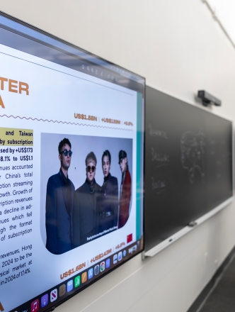 close up of Greater China on screen while teacher lectures in the background