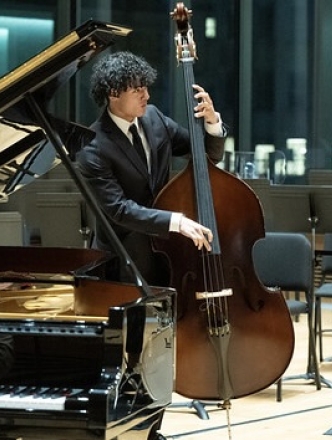 Jazz performers: piano, bass and drummer