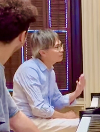 Professor working with piano student