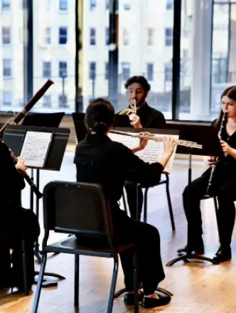 Five Woodwind players performing in paulson center room 620