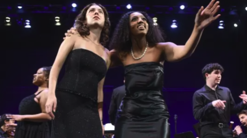 Two Vocal performance students singing on stage